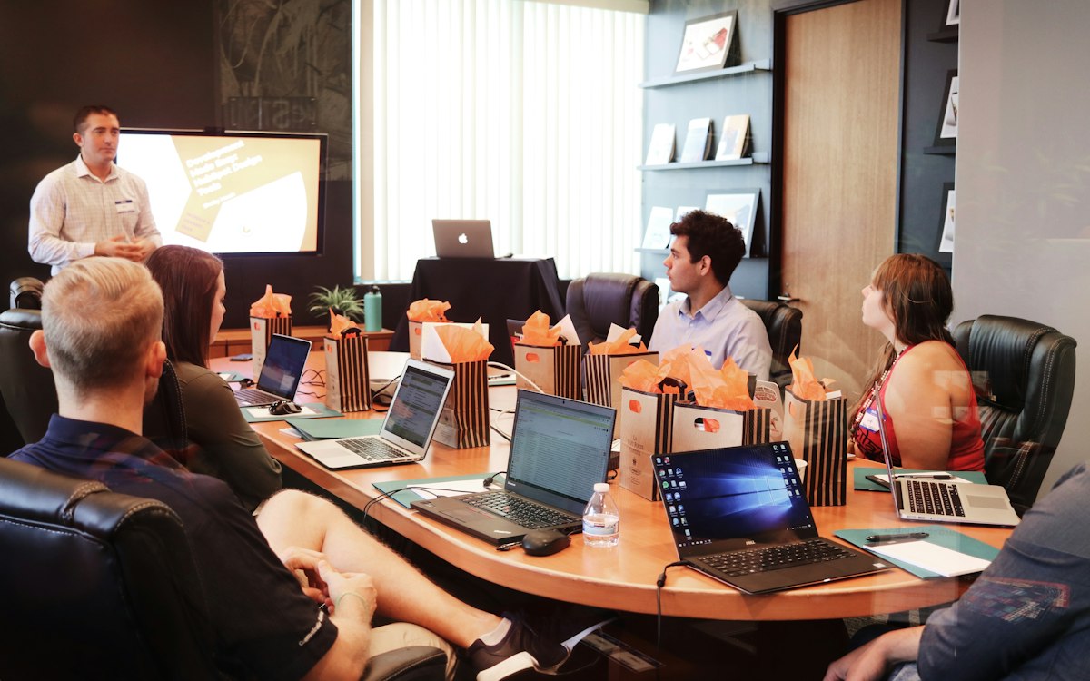 A group taking part in a workshop around a table.