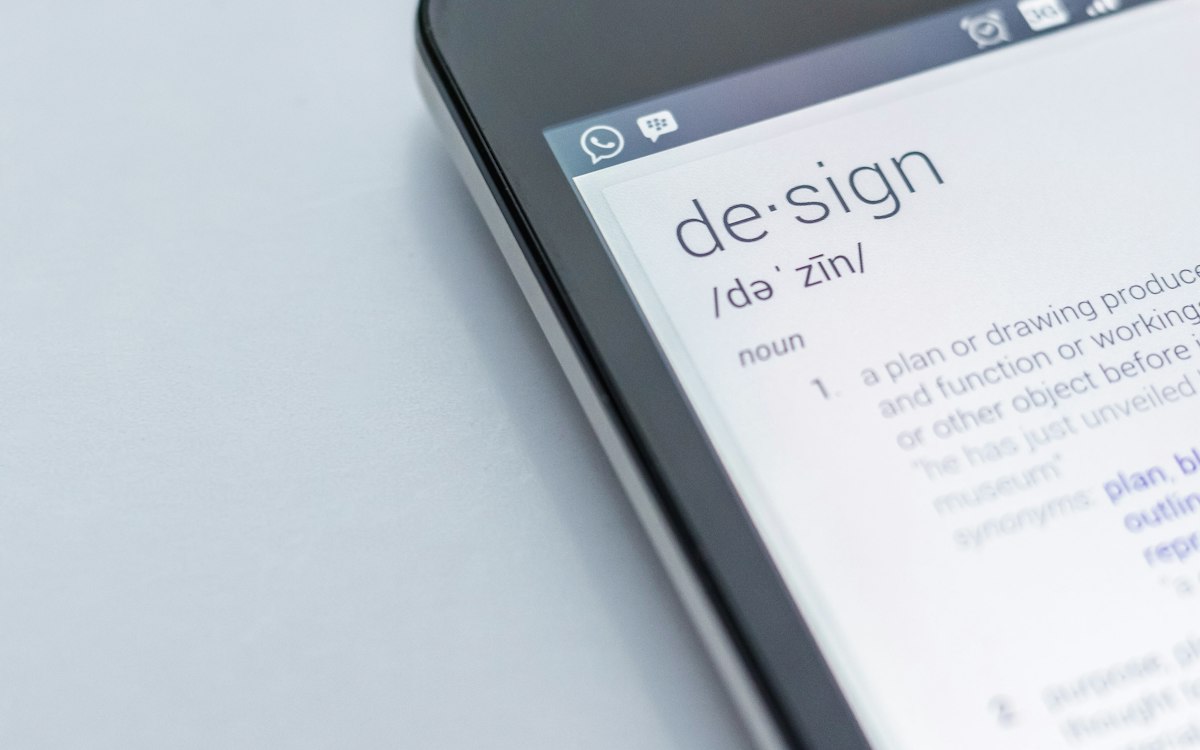 A close-up of a dictionary entry for design.
