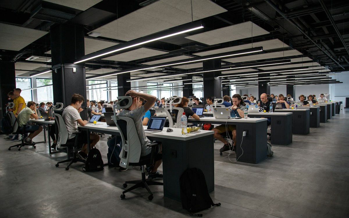 A team working at computers in an open studio.
