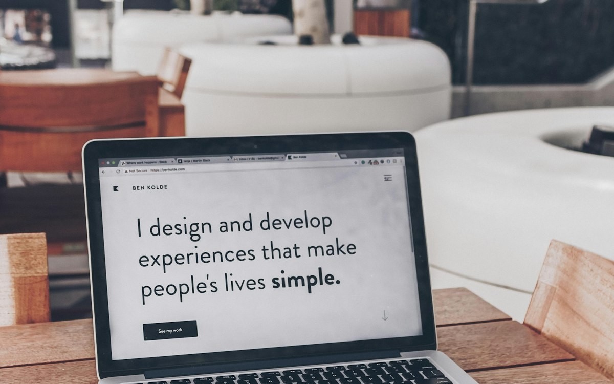 A laptop showing a designer’s description of their work.